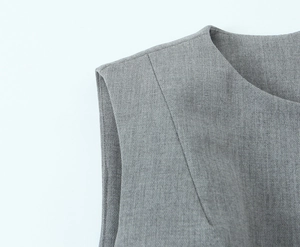 Detailed macro view of the shoulder and neckline texture on a gray sleeveless dress