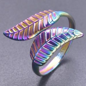 Macro detail of rainbow plated steel leaf ring showing colorful iridescent texture