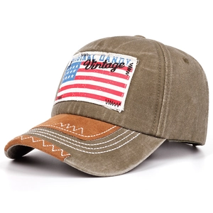 Detail of vintage baseball cap with American flag patch and suede brim contrast stitching