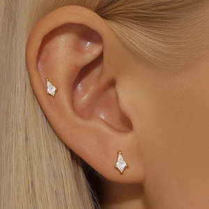 Detailed view of S925 silver gold-plated kite stud earrings with clear sparkling zircon
