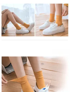 Detail of mustard yellow cotton ribbed crew socks with elastic stretch and breathable texture