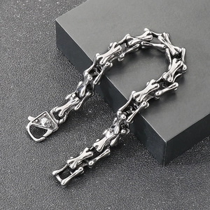 Punk style stainless steel bone link bracelet with skull clasp in vintage silver finish