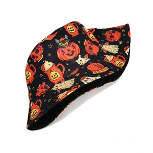 Detailed view of the vibrant Halloween cartoon pattern on a reversible bucket hat