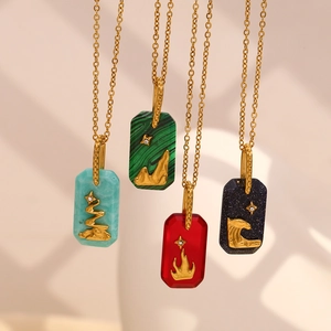 Detailed close-up of 18K gold plated rectangular pendants with colorful stone textures