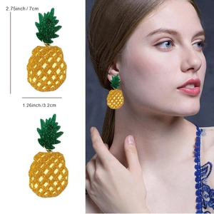 Sparkly acrylic pineapple earrings for women with dimensions and model display