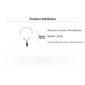 Detailed ceramic fish pendant with colorful wooden beads on ethnic style woven necklace