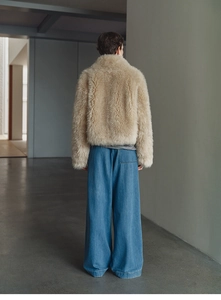 Back view of beige faux fox fur cashmere vest showing sleek silhouette and plush texture