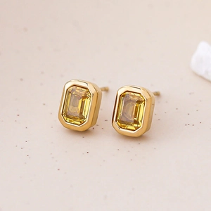 Elegantes pendientes de oro con circonitas amarillas rectangulares de estilo vintage