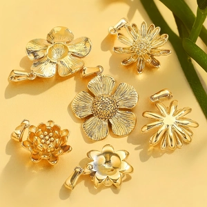 Set of 18K gold plated stainless steel floral pendants in various daisy and lotus styles