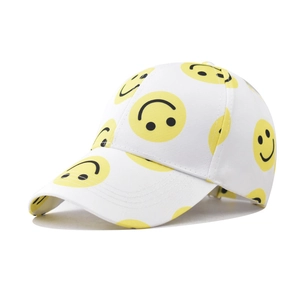 White cotton baseball cap featuring all-over yellow smiley face prints and curved brim