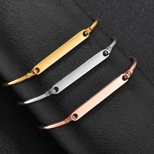 Polished stainless steel open bracelets in gold, silver, and rose gold with engravable bars