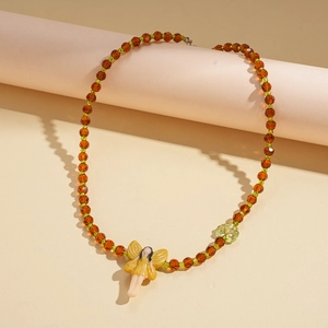 Vintage fairy pendant necklace with amber crystal beads and a green flower charm