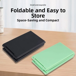 Detail view of foldable portable mirrors in black and mint green compact multi-layer design