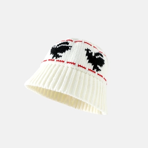 White knitted bucket hat with black rooster pattern and red accents in cozy crochet style