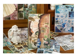 Close-up of vintage Chinese style scrapbooking stickers with landscapes and calligraphy