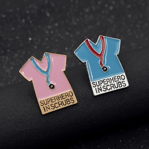 Cartoon enamel pin set with superhero in scrubs design and stethoscopes in pink and blue