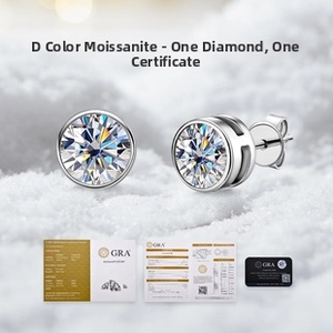 Macro shot of D color Moissanite stud earrings with GRA certification on snowy background