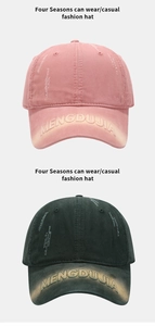 Detail view of MENGDUJIA embroidery and distressed texture on vintage baseball caps
