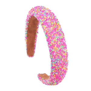 Pink glitter headband with colorful sugar beads on a professional white background