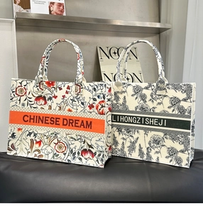 Detail view of two felt tote bags featuring blue floral porcelain prints and central banners
