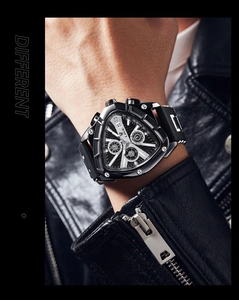 Detail shot of men's triangle quartz watch with luminous dial on wrist