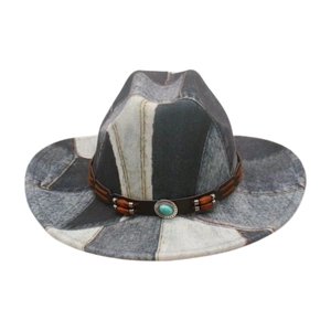 Detail of ethnic western hat featuring turquoise silver buckle and wooden bead band