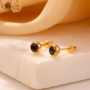 Classic round titanium steel earrings with black zircon stones in gold bezel setting