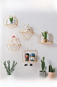Modern gold geometric wall shelves in round and hexagonal shapes with wood base