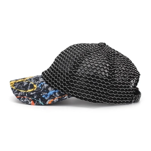 Close-up of black breathable mesh baseball cap featuring colorful graffiti printed brim