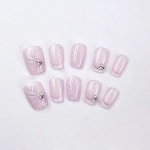 French style short pink press-on nails with white ribbons, pearls and rhinestones