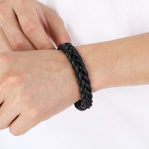 Men's black braided microfiber leather bracelet with magnetic steel clasp on wrist