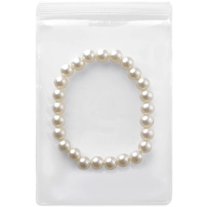 Transparent PVC self-sealing jewelry bag with a white pearl bracelet inside on white background