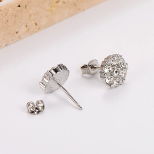 Elegant plum blossom stud earrings featuring silver plating and clear crystal accents