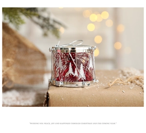 Silver and red Christmas drum ornament with white snowflake patterns on gift box