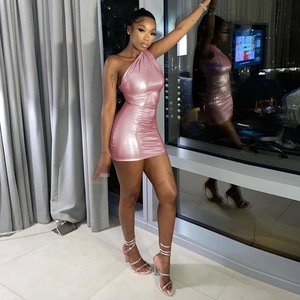 Close-up of pink metallic fabric on a sexy one-shoulder sleeveless mini bodycon dress