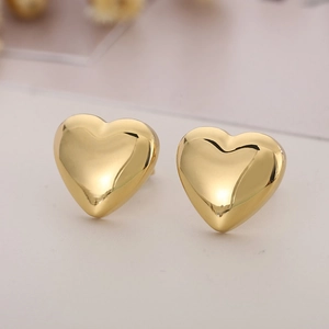 Close-up of polished 18K gold plated stainless steel heart stud earrings for women
