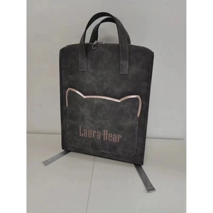 Detail of grey laptop backpack showing cat-ear pocket design and Laura Bear logo