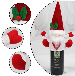 Detail of Christmas gnome wine bottle cover with soft knit texture and plush beard