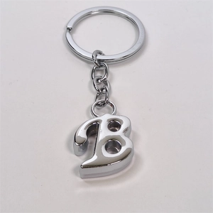 Polished silver metal keychain featuring a 3D letter B pendant on a simple ring