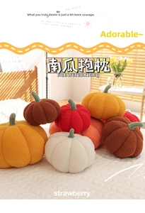 Close-up of soft plush pumpkin pillow texture with realistic green stem detail
