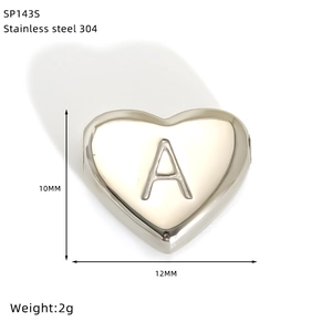 Detail view of heart-shaped stainless steel charm with engraved letter A and size specs