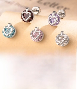 Detail showing titanium steel heart studs with five colors of cubic zirconia