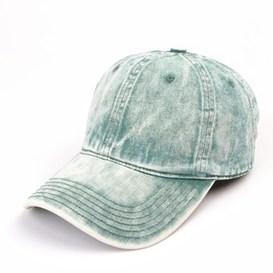 Macro detail of vintage washed turquoise denim baseball cap with reinforced stitching
