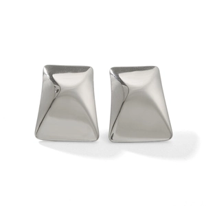 Macro shot of silver stainless steel trapezoid stud earrings with a glossy mirror finish