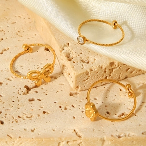 Set of three 18K gold plated bow and flower open rings with zircon in minimalist style