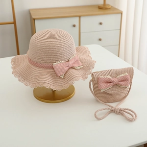 Kids pink straw hat and crossbody bag set with white polka dot bows and lace trim
