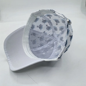 White baseball cap with swan print showing inner lining, sweatband and metal buckle