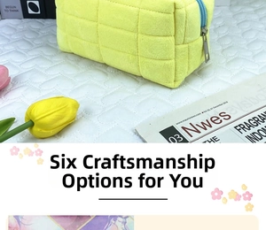 Detail of yellow quilted pencil case featuring large square stitching and blue zipper
