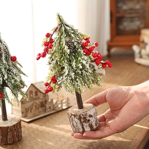 24cm mini artificial Christmas tree with red berries and snow on a natural wood base