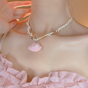 Vacation style starfish necklace featuring pink shell pendant and irregular pearls
